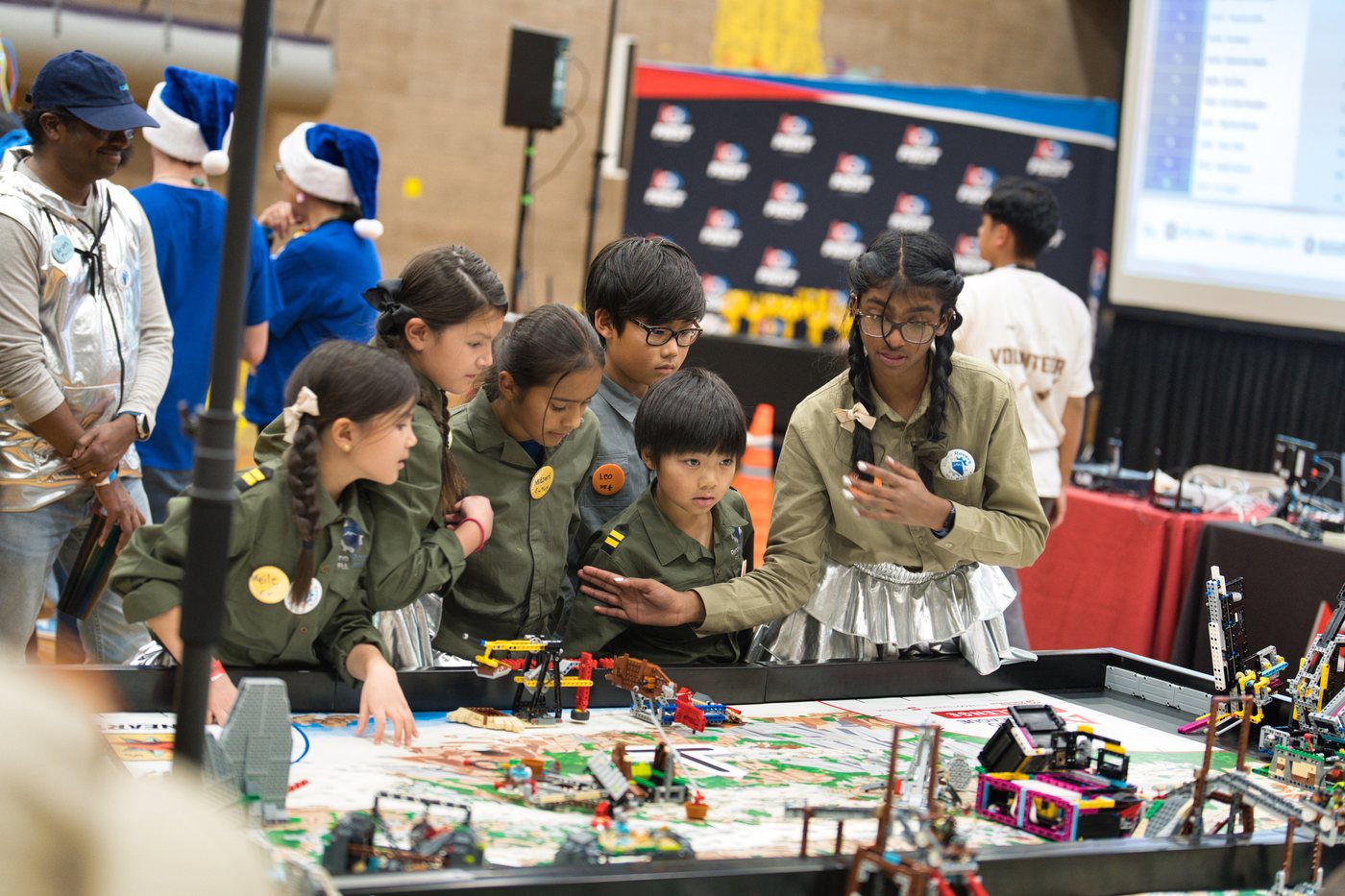 Reno Rovers students working together at a robot game table