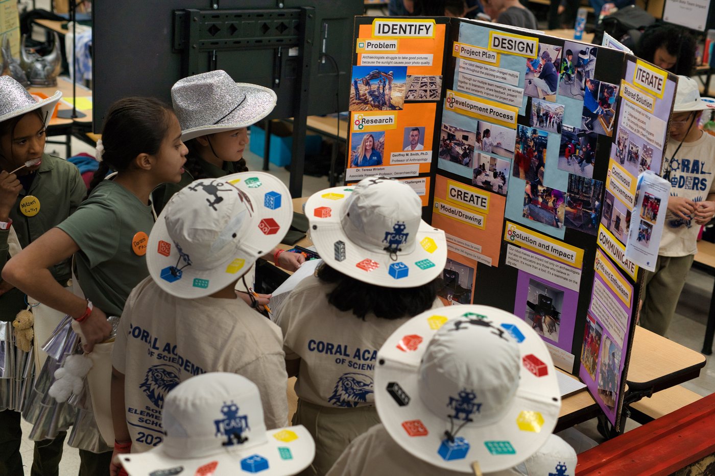 Reno Rovers students discussing a project board during festival judging