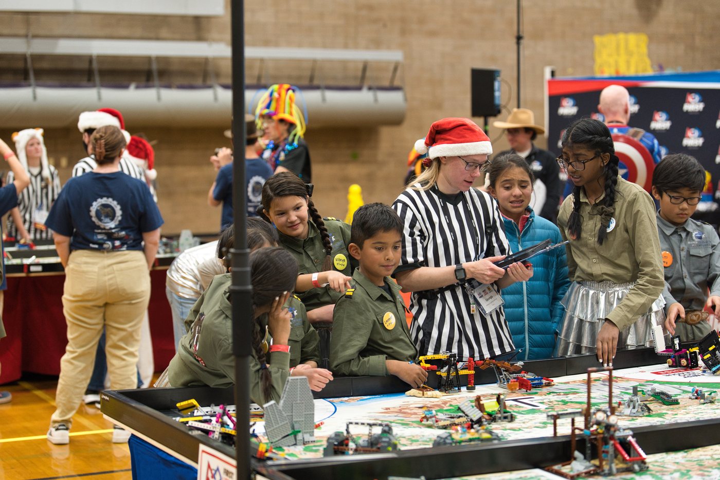 Reno Rovers students working together at a FIRST LEGO League robot game table